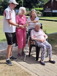 Winners Anne Peck, Anna Sherwood and Jason Walter, receive the John Crock trophy from Helen Branch